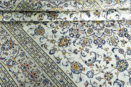 Surface texture of 2000s Kashan rug with natural Wool and intricate pattern