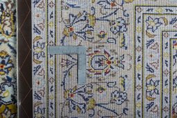 Central medallion detail of 2000s Kashan rug from Iran / Persia