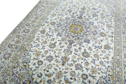 Backside of handmade 2000s Kashan rug showing knot structure and weave density