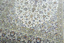 Close-up detail of 2000s Kashan rug from Iran / Persia showing Wool weave