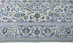 Corner detail of 2000s Kashan rug showing border pattern and Wool pile