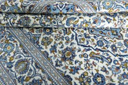 Close-up detail of 2000s Kashan rug from Iran / Persia showing Wool weave