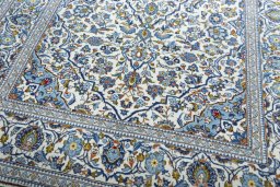 Close-up detail of 2000s Kashan rug from Iran / Persia showing Wool weave