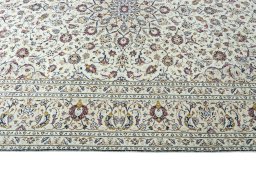 Corner detail of 2000s Kashan rug showing border pattern and Wool pile