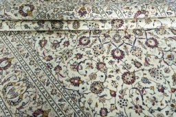 Close-up detail of 2000s Kashan rug from Iran / Persia showing Wool weave