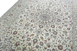 Backside of handmade 2000s Kashan rug showing knot structure and weave density