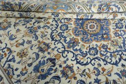 Close-up detail of 2000s Kashan rug from Iran / Persia showing Wool weave