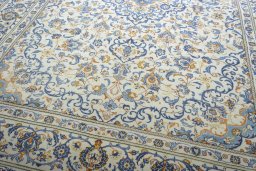 Close-up detail of 2000s Kashan rug from Iran / Persia showing Wool weave