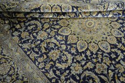 Close-up detail of New Kashan rug from Iran / Persia showing Cork weave