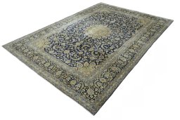 Corner detail of New Kashan rug showing border pattern and Cork pile