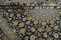 Close-up detail of 2000s Kashan rug from Iran / Persia showing Wool weave