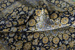 Surface texture of 2000s Kashan rug with natural Wool and intricate pattern
