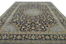 Surface texture of 2000s Kashan rug with natural Wool and intricate pattern