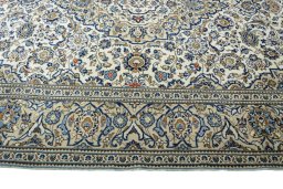 Corner detail of New Kashan rug showing border pattern and Wool pile