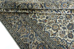Close-up detail of New Kashan rug from Iran / Persia showing Wool weave