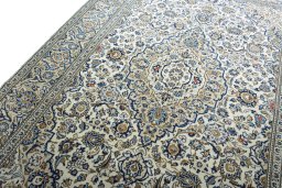 Backside of handmade New Kashan rug showing knot structure and weave density