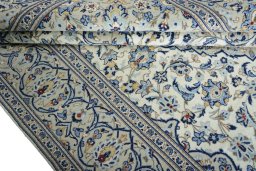 Close-up detail of 2000s Kashan rug from Iran / Persia showing Wool weave
