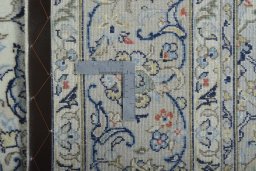 Backside of handmade New Kashan rug showing knot structure and weave density