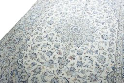 Backside of handmade New Kashan rug showing knot structure and weave density
