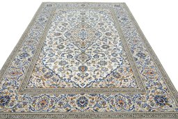 Surface texture of 2000s Kashan rug with natural Wool and intricate pattern