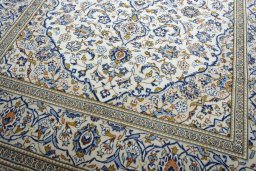 Close-up detail of 2000s Kashan rug from Iran / Persia showing Wool weave