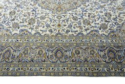 Corner detail of 2000s Kashan rug showing border pattern and Wool pile