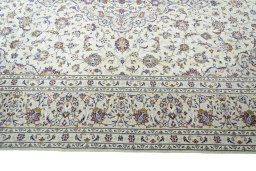 Corner detail of New Kashan rug showing border pattern and Wool pile