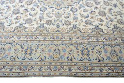 Corner detail of New Kashan rug showing border pattern and Wool pile