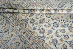 Close-up detail of New Kashan rug from Iran / Persia showing Wool weave