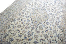 Backside of handmade New Kashan rug showing knot structure and weave density