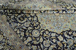 Close-up detail of 2000s Kashan rug from Iran / Persia showing Wool weave