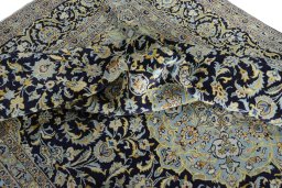 Surface texture of 2000s Kashan rug with natural Wool and intricate pattern