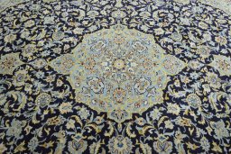 Central medallion detail of 2000s Kashan rug from Iran / Persia
