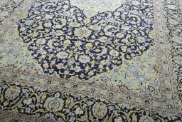 Close-up detail of 2000s Kashan rug from Iran / Persia showing Wool weave