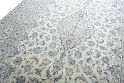 Backside of handmade New Kashan rug showing knot structure and weave density