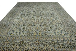 Surface texture of 2000s Kashan rug with natural Wool and intricate pattern