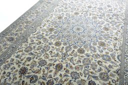 Backside of handmade New Kashan rug showing knot structure and weave density