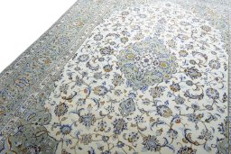 Backside of handmade 2000s Kashan rug showing knot structure and weave density