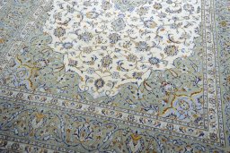 Close-up detail of 2000s Kashan rug from Iran / Persia showing Wool weave