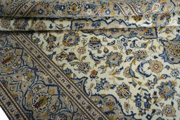 Close-up detail of 2000s Kashan rug from Iran / Persia showing Wool weave