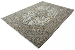 Corner detail of 2000s Kashan rug showing border pattern and Wool pile