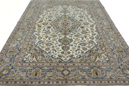 Surface texture of 2000s Kashan rug with natural Wool and intricate pattern