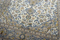 Close-up detail of 2000s Kashan rug from Iran / Persia showing Wool weave