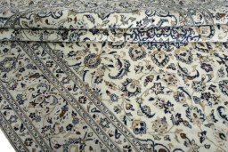 Close-up detail of New Kashan rug from Iran / Persia showing Wool weave
