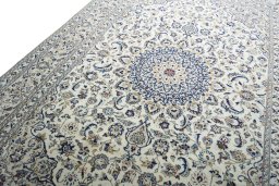 Backside of handmade New Kashan rug showing knot structure and weave density