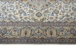 Corner detail of New Kashan rug showing border pattern and Wool pile