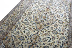 Backside of handmade New Kashan rug showing knot structure and weave density