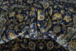 Surface texture of 2000s Kashan rug with natural Wool and intricate pattern