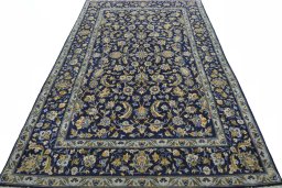 Surface texture of 2000s Kashan rug with natural Wool and intricate pattern