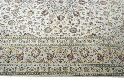 Corner detail of New Kashan rug showing border pattern and Wool pile